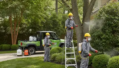 Tick control technician servicing a Louisville, KY yard for a tree-service business
